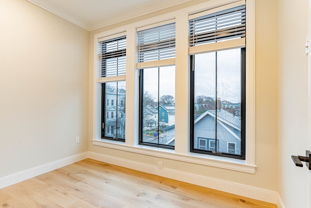157 Everett Street, Unit 302 Boston, MA 02134 - Photo 4 of 11 a view of a room that has a window in it