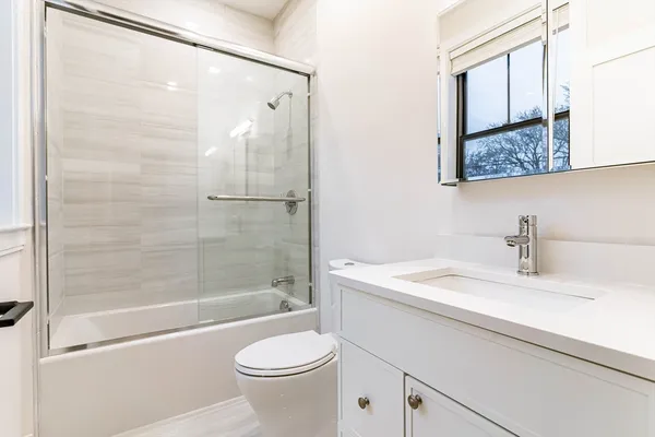 a bathroom with a sink a toilet and a bathtub