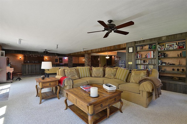 6-n034 Corron Road St. Charles, IL 60175 - Photo 19 of 25 a living room with furniture a ceiling fan and a book shelf