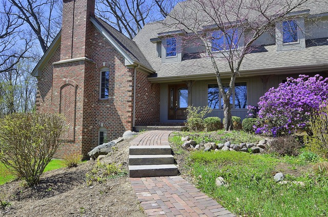 6-n034 Corron Road St. Charles, IL 60175 - Photo 4 of 25 a front view of a house with a porch