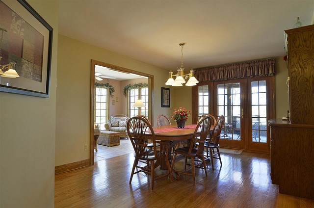 6-n034 Corron Road St. Charles, IL 60175 - Photo 10 of 25 a view of a dining room with furniture window and wooden floor