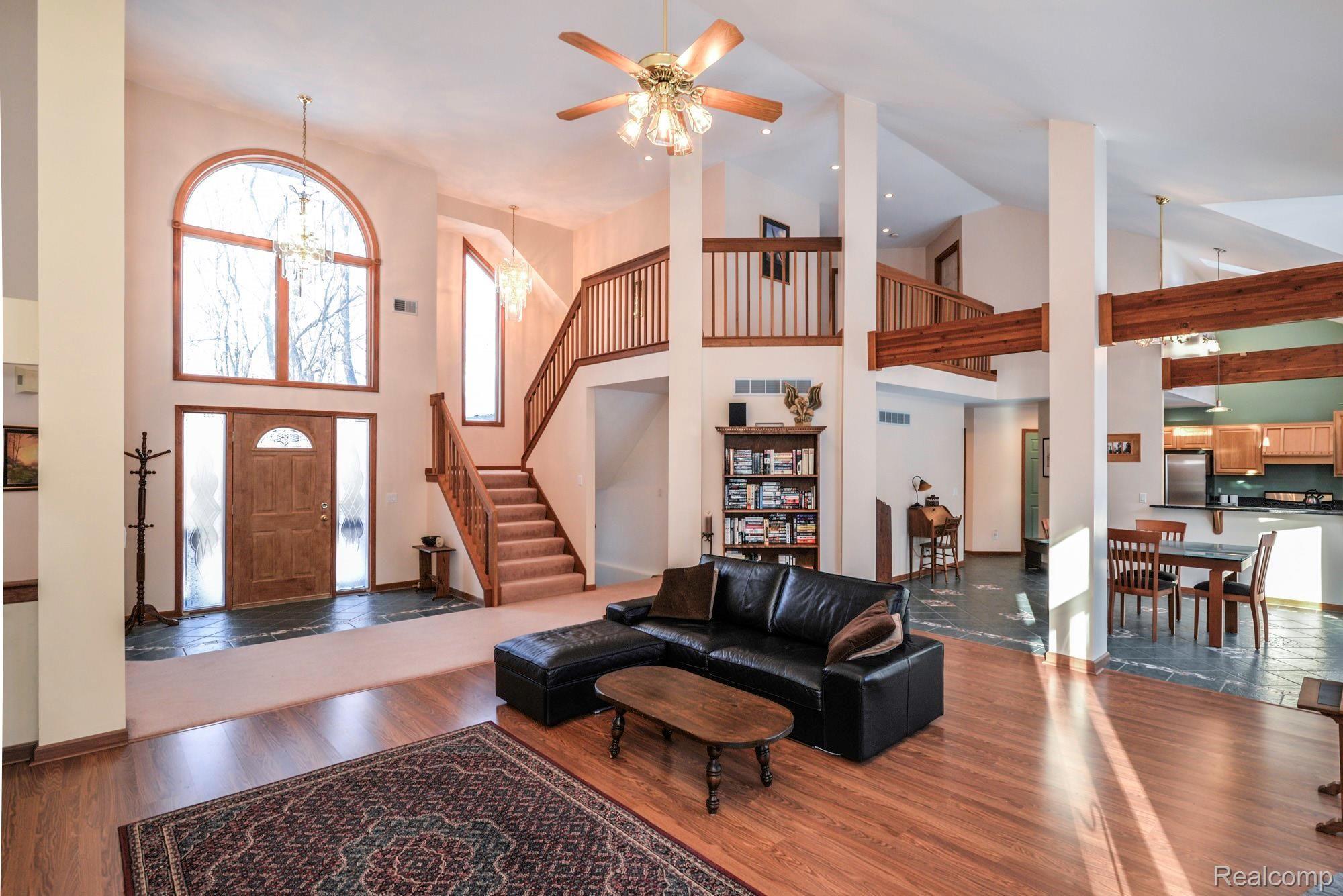 7844 Winans Lake Road Brighton, MI 48116 - Photo 34 of 38 Desired Open Floor Plan Featuring Wood Beams
