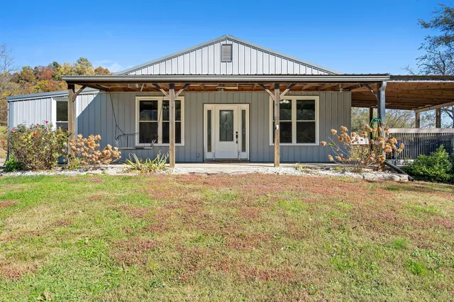 front view of a house with a yard