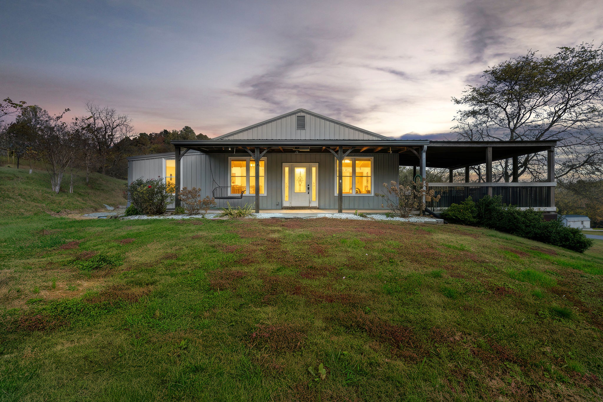 183 Puncheon Camp Lane Bell Buckle, TN 37020 - Photo 2 of 51 a front view of a house with a yard and garage