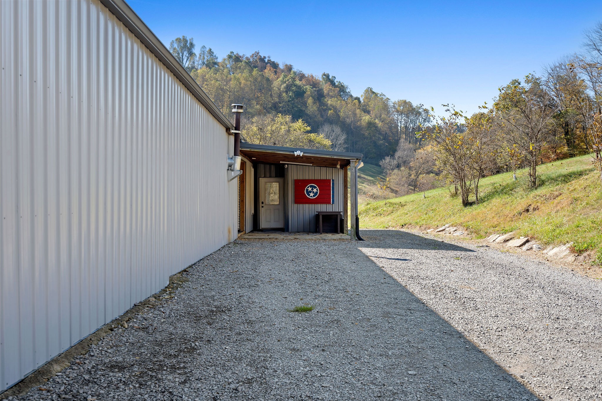 183 Puncheon Camp Lane Bell Buckle, TN 37020 - Photo 22 of 51 a view of a house with a yard and garage