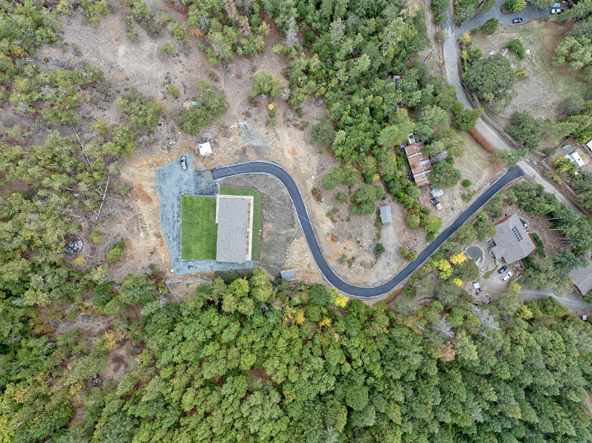 5572 Jumpoff Joe Creek Road Grants Pass, OR 97526 - Photo 23 of 38 an aerial view of a house