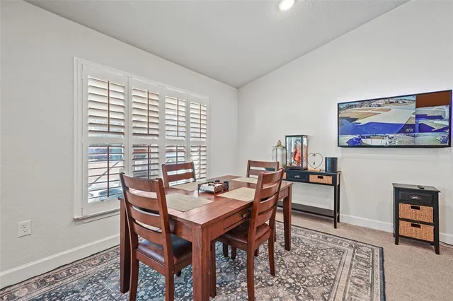 a kitchen with stainless steel appliances kitchen island granite countertop a refrigerator and a stove