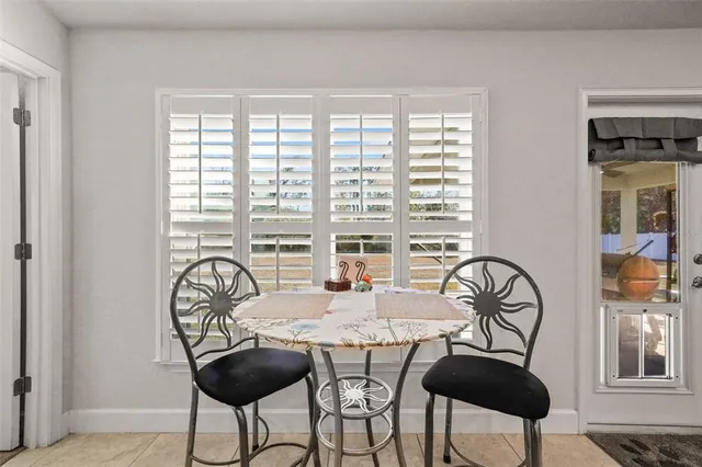 a bed room with a bed and a window