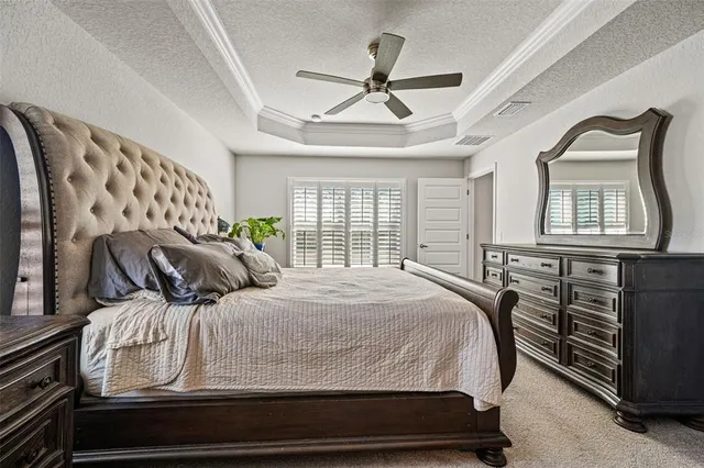 a spacious bathroom with a granite countertop sink a toilet mirror and a bathtub
