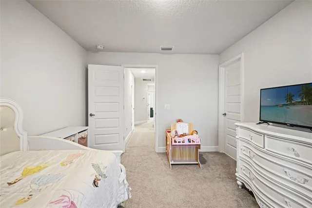 a bathroom with a granite countertop sink toilet and a mirror