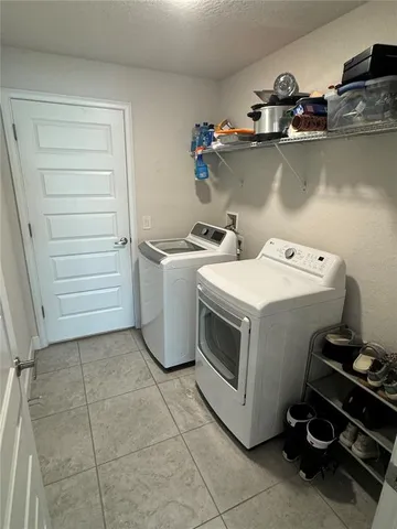 an aerial view of residential building with ocean view