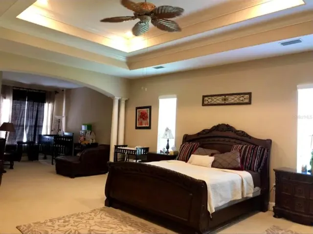 a bedroom with a bed and window