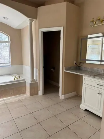 a view of a kitchen with washing machine and sink