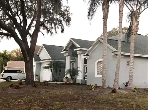a view of a house with a yard
