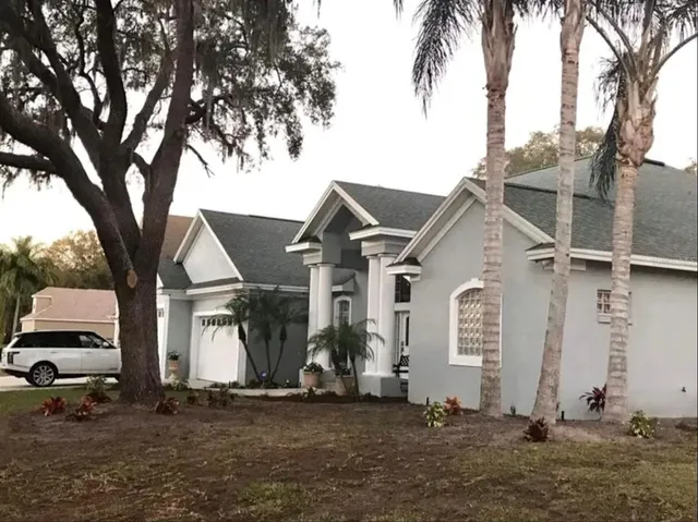 a view of a house with a yard
