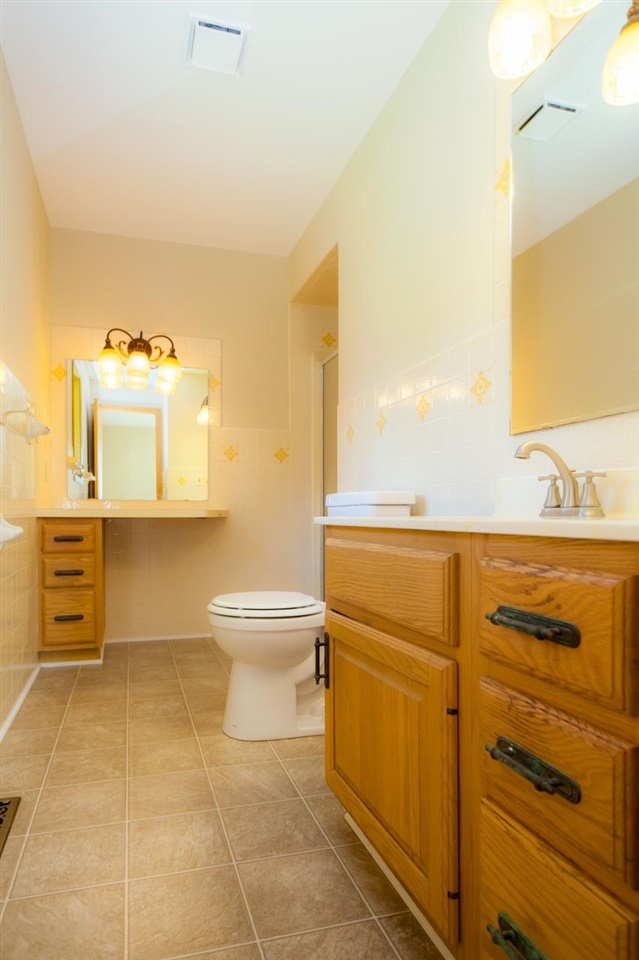 18660 Burr Oak Road Capron, IL 61012 - Photo 15 of 25 a bathroom with a toilet sink and mirror