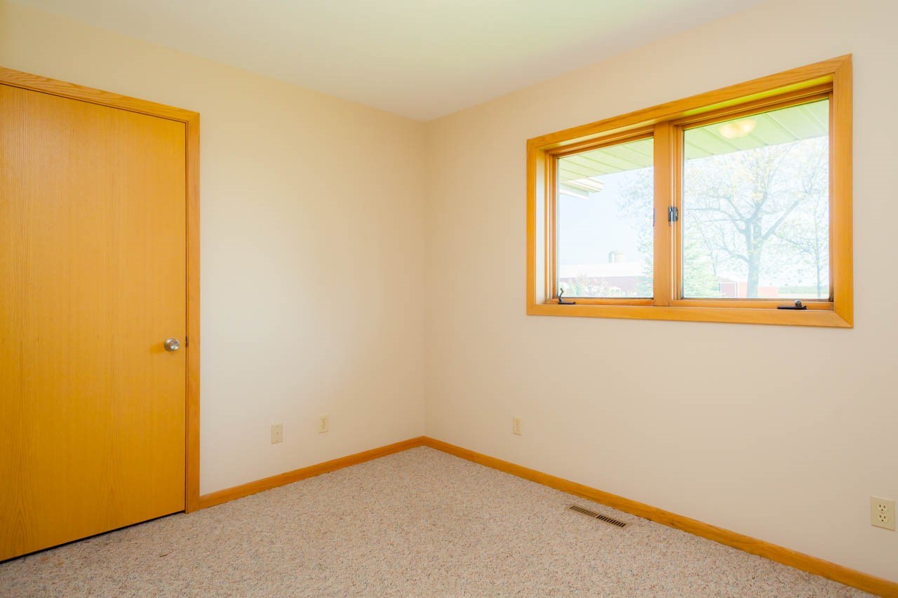 18660 Burr Oak Road Capron, IL 61012 - Photo 16 of 25 a view of an empty room with a window