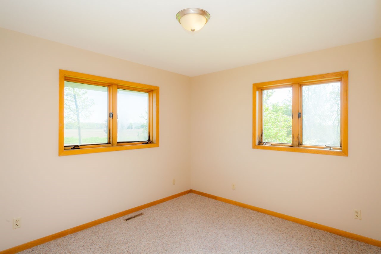 18660 Burr Oak Road Capron, IL 61012 - Photo 17 of 25 a view of an empty room with a window