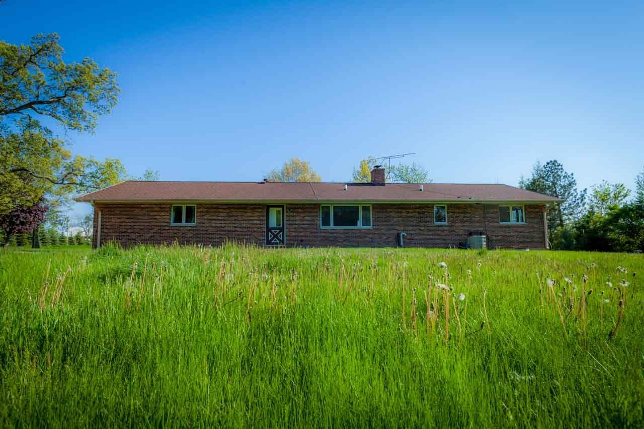 18660 Burr Oak Road Capron, IL 61012 - Photo 19 of 25 a view of a house with a yard