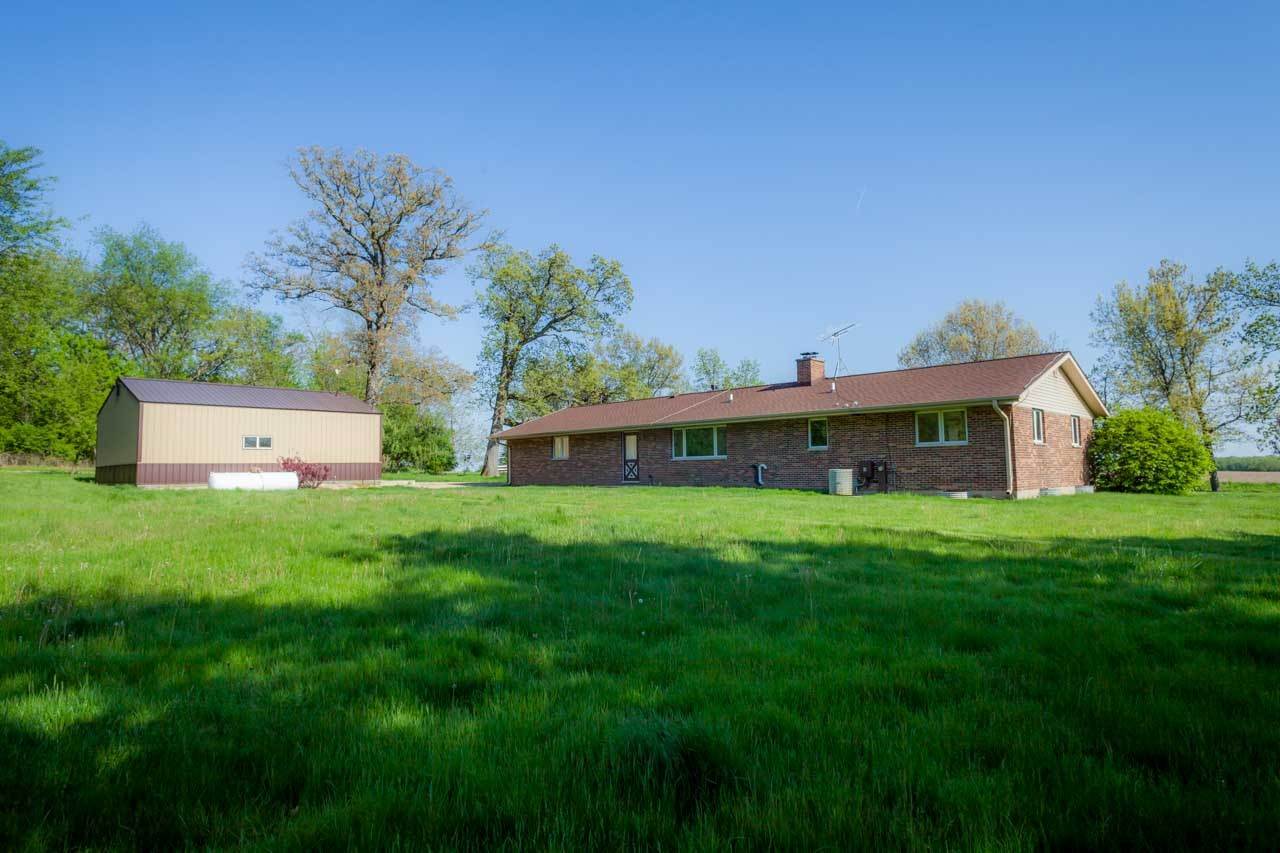 18660 Burr Oak Road Capron, IL 61012 - Photo 22 of 25 a view of a house with a yard and a tree