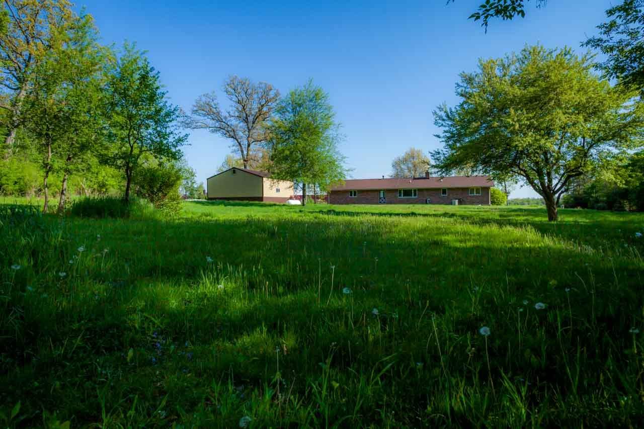 18660 Burr Oak Road Capron, IL 61012 - Photo 23 of 25 a view of a big yard with large trees