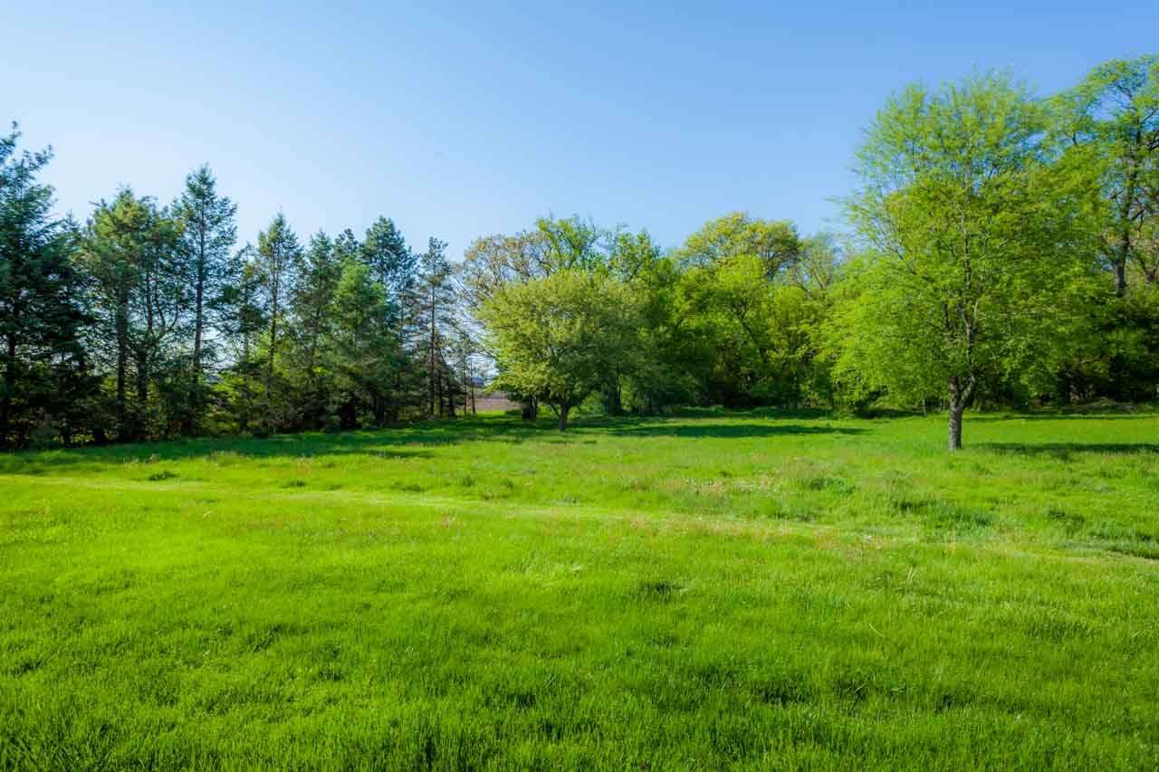 18660 Burr Oak Road Capron, IL 61012 - Photo 24 of 25 a backyard of a house with lots of green space