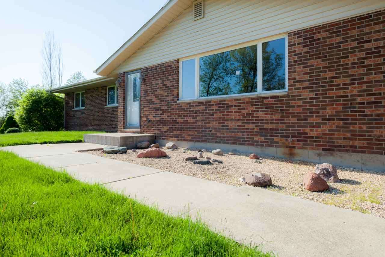 18660 Burr Oak Road Capron, IL 61012 - Photo 3 of 25 a front view of a house with a yard