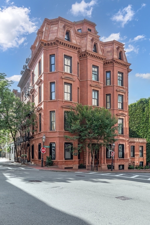 a tall building sitting on the side of a street