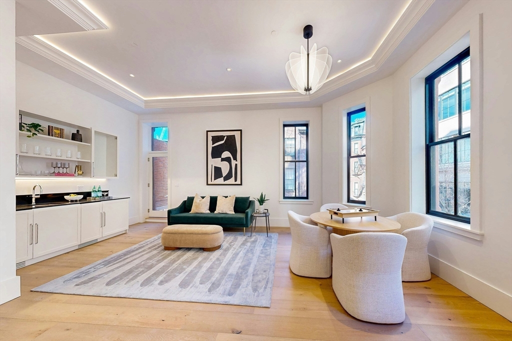 57 Hancock Street Boston, MA 02114 - Photo 16 of 42 a living room with furniture and wooden floor