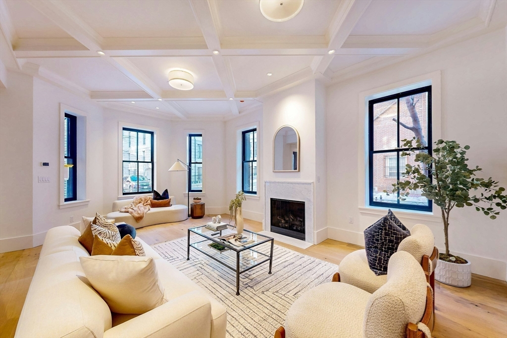 57 Hancock Street Boston, MA 02114 - Photo 9 of 42 a living room with furniture fireplace and potted plant