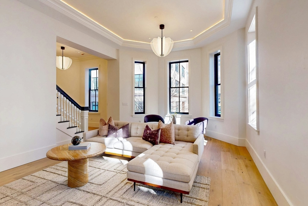57 Hancock Street Boston, MA 02114 - Photo 10 of 42 a living room with furniture and a potted plant