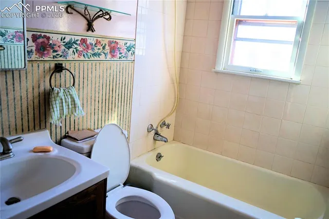 a bathroom with a sink and a bathtub