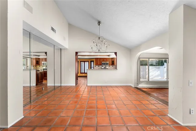 a view of an empty room with glass door