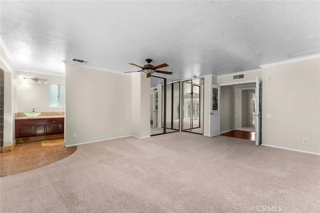 a bath tub sitting in a bathroom next to a window