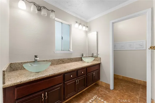 a view of an empty room with wooden floor and windows