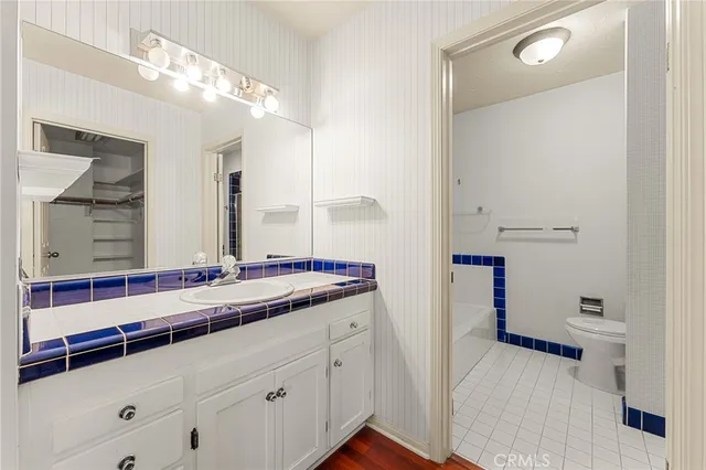 an aerial view of a house with a garden and mountain view