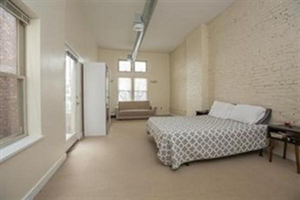 296 Meridian Street, Unit 1 Boston, MA 02128 - Photo 3 of 9 a room with a bed and a window