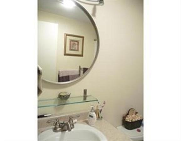 296 Meridian Street, Unit 1 Boston, MA 02128 - Photo 5 of 9 a bathroom with a sink and a mirror