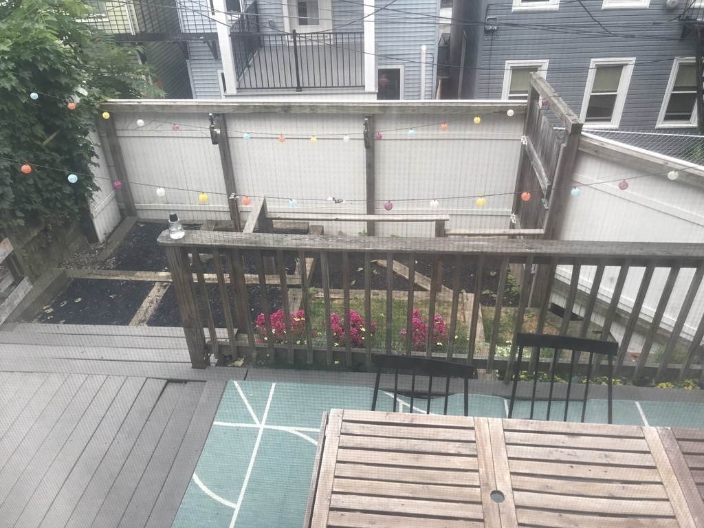 296 Meridian Street, Unit 1 Boston, MA 02128 - Photo 7 of 9 a view of a balcony with a ocean view