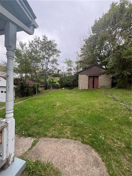 928 Locust Avenue Monessen, PA 15062 - Photo 6 of 7 a view of a house with a yard and sitting area