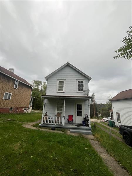 928 Locust Avenue Monessen, PA 15062 - Photo 7 of 7 a view of a house with a yard and sitting area