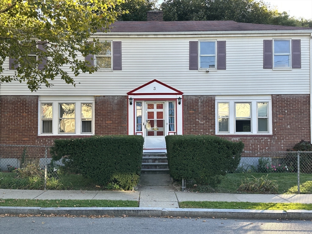3 Arborcrest Terrace, Unit 2 Boston, MA 02126 - Photo 1 of 29 a front view of a house with a yard and potted plants
