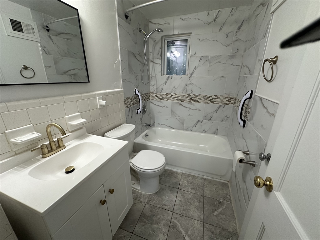 3 Arborcrest Terrace, Unit 2 Boston, MA 02126 - Photo 19 of 29 a bathroom with a sink toilet and shower