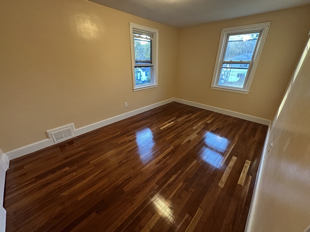 3 Arborcrest Terrace, Unit 2 Boston, MA 02126 - Photo 24 of 29 a view of room with window and wooden floor