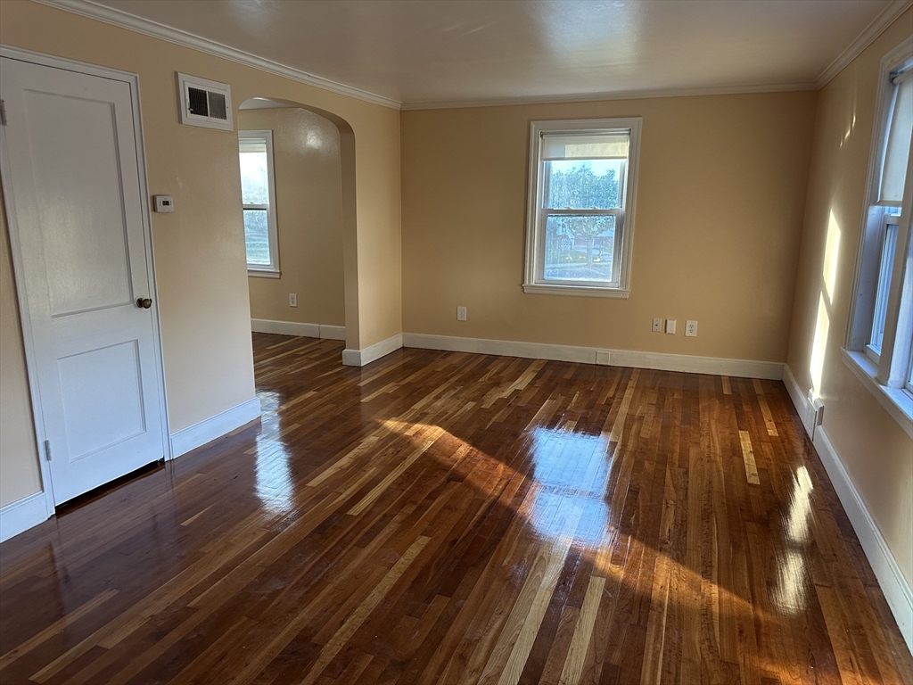 3 Arborcrest Terrace, Unit 2 Boston, MA 02126 - Photo 5 of 29 a view of a room with wooden floor and workspace