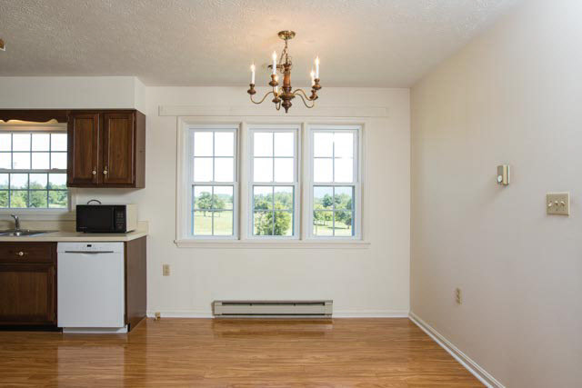 2408 River Road New Market, VA 22844 - Photo 5 of 16 a view of a kitchen with a sink dishwasher and a fireplace