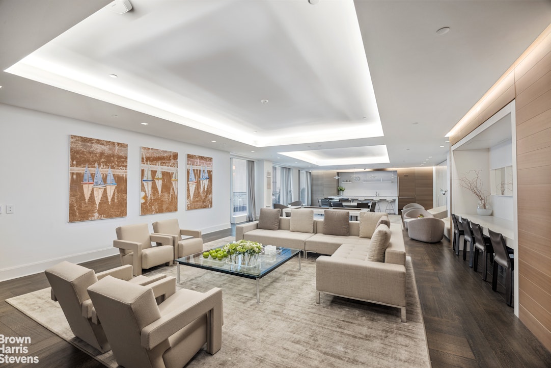 1289 Lexington Avenue, Unit 11D Manhattan, NY 10028 - Photo 12 of 16 a living room with furniture and wooden floor