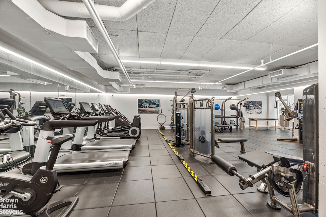 1289 Lexington Avenue, Unit 11D Manhattan, NY 10028 - Photo 13 of 16 a view of a room with gym equipment