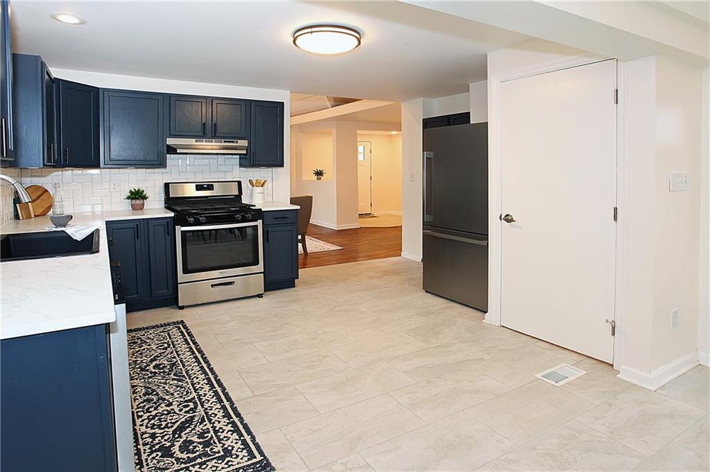 46 Michael Road Russellton, PA 15076 - Photo 11 of 25 a kitchen with stainless steel appliances granite countertop a refrigerator stove top oven a sink and dishwasher