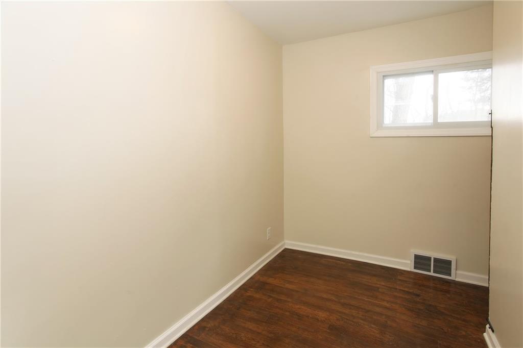 46 Michael Road Russellton, PA 15076 - Photo 15 of 25 an empty room with wooden floor and windows
